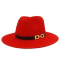 Detail of red straw Panama hat showing fine weave texture and black band with gold buckle - Red