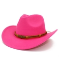 Detail of hot pink felt cowboy hat featuring a bronze skull emblem on a woven leather band - Rose Red