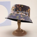 Retro floral patchwork bucket hat with orange and grey patterns on a wooden stand - Gray Orange Brown Vintage Rural Patchwork (70)