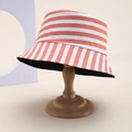 Detailed close-up of orange and white striped bucket hat on a vintage wooden stand - Orange White Block Stripes (43)