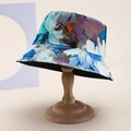 Detail of artistic abstract floral print bucket hat in blue and purple on wooden stand - Blue Purple Floral