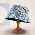 Detailed view of bohemian floral bucket hat with intricate blue patterns on wood stand - One Size / Blue White Floral Patchwork (Color 5)