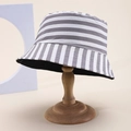 Detail of grey and white striped bucket hat on a wooden display stand for sun protection - Gray White Two-Way Stripes (44)