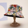 Detailed view of floral bucket hat with colorful patterns and reinforced stitching - Orange-Green-Purple Floral (Color 4)