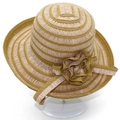 Detailed close-up of a striped straw sun hat featuring a decorative layered side flower - Brown