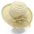 Close-up of elegant summer sun hat featuring detailed fabric flower and ribbon decoration - Beige