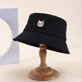 Detailed view of a black cotton bucket hat with cat embroidery on a wooden stand - One Size / Black