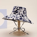 Detail of classic wide-brim sun hat featuring dark blue floral prints and windproof ties - Cream Navy Abstract Floral Style (3#)
