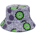 Detailed view of vibrant green and purple floral patterns on a stylish fabric bucket hat - Reversible / Green Floral