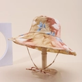 Detail of floral bucket hat with ribbon tie, sun protection accessory for outdoors - Beige Floral With Red Blue (1#)