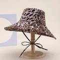Close-up of leopard print sun hat featuring a wide brim and adjustable bow chin strap - Tan Leopard Print Style (10#)