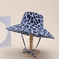 Detail of blue leopard print sun hat with matching chin strap on wooden stand - Blue Black Leopard Style (11#)