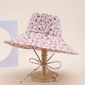 Detailed view of a pink floral sun hat with ribbon ties on a wooden display stand - Pink With Purple Floral Style (13#)