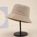 Elegant beige bucket hat with bubble texture and sparkling rhinestones on metal stand - One Size / Khaki