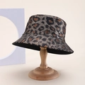 Detail of leopard print bucket hat with metallic sheen displayed on a wooden stand - Dark Grey Leopard