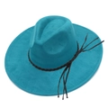 Detail view of teal faux suede fedora featuring black braided rope and long tassels - Dark Blue