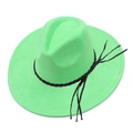 Detailed macro view of the bright green suede jazz hat with a black tassel leather band - Green