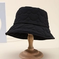 Chic black heart-quilted bucket hat for women on wooden stand for autumn and winter fashion - Black