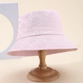 Pink lace floral bucket hat with 3D embroidery and wide brim on a wooden stand - Pink