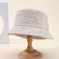 Classic beige checkered tweed bucket hat for women with elegant woven texture on a stand - Beige