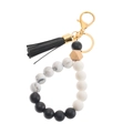 Macro shot of silicone beads and a geometric wood bead with black leather tassel detail - Black (43769-BC1805)