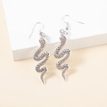 Detailed close-up of snake earrings showing intricate silver scale textures and fishhooks - Antique Silver