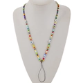 Detail of colorful beaded phone lanyard featuring evil eye beads on a white display - Colorful