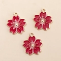 Three red cherry blossom charms with gold-plated edges and metal hanging loops - Red Cherry Blossom