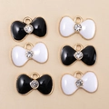 Detail of DIY bow pendants in black and white enamel with sparkling center rhinestones - Black and White Bow