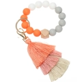 Detail of beaded silicone keychain bracelet with wooden bead and triple-layer tassel charms - Orange