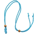 Detail of blue hand-woven cord necklace with dark wood beads and small stone mesh pocket - Blue Net Pocket Necklace / Blue