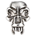 Detailed close-up of a vintage silver skull bead with tusks and aged finish for DIY jewelry - Viking Fang Skull Style