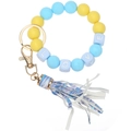Detail of yellow and blue silicone bead bracelet with LOVE cubes and a striped tassel charm - Blue Yellow Leopard Tassel