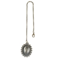 Detail of vintage bronze alloy pendant with oval gemstone and intricate hollowed wavy frame - Bronze Resin Lid Photo Frame Pendant