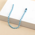 Macro view of light blue bead chain connector for DIY tags and keychain accessories - Blue