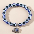 Blaues Evil Eye Perlenarmband mit silbernem Elefantenanhänger und verzierten Metallzwischenperlen - Blauer Elefant