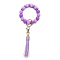 Detail of purple silicone bead keychain with XOXO pattern, lobster clasp, and leather tassel - OXOX Purple Beaded Tassel Keychain