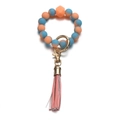 Detail of luminous marble silicone bead keychain with pink leather tassel and gold ring - Gradient Blue & Orange