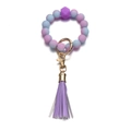 Dettaglio di perle in silicone sfumate viola e blu con anello dorato e nappa decor - Sfumatura Viola-Blu