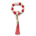 Dettaglio portachiavi a bracciale con perle in silicone rosse e bianche e nappina in pelle - Stile Rosso Bianco