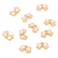 Detailed close-up of pink bow charms with gold edges for DIY jewelry making - Bow Tie / White