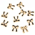 Detailed macro view showing the front and back of black enamel bow jewelry charms - Bow / Black