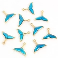 Macro view of ten gold-plated mermaid tail pendants with deep blue enamel coating - Gold Blue Fish Tail Style (67116-B3-2502)