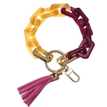 Close-up of acrylic link chain keychain with metallic gold ring and purple leather tassel - Purple Yellow
