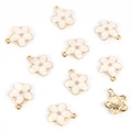 Detailed macro view of white enamel flower pendants with gold-plated metal alloy finish - Flower / White