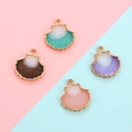 Detailed macro view of colorful shell-shaped alloy pendants with shimmering resin and glitter - Scallop Style (4763-F0401)