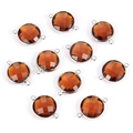 Detailed view of ten amber round faceted glass crystal charms with silver metal frames - Brown