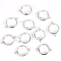 Detail of round faceted glass crystal charms with silver frames for DIY jewelry making - Clear