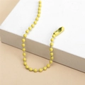 Macro view of bright yellow metal ball chain with secure connector for DIY keychains - Yellow