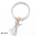 Detail of silver embossed PU leather wristlet keychain with gold ring and tassel charm - Textured Silver (BK-010)